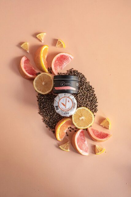 hemp collective orange, grapefruit and lemon shampoo bar on seeds and orange background