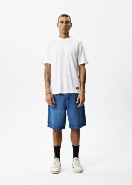Model wearing Afends Lil C Hemp baggy denim shorts