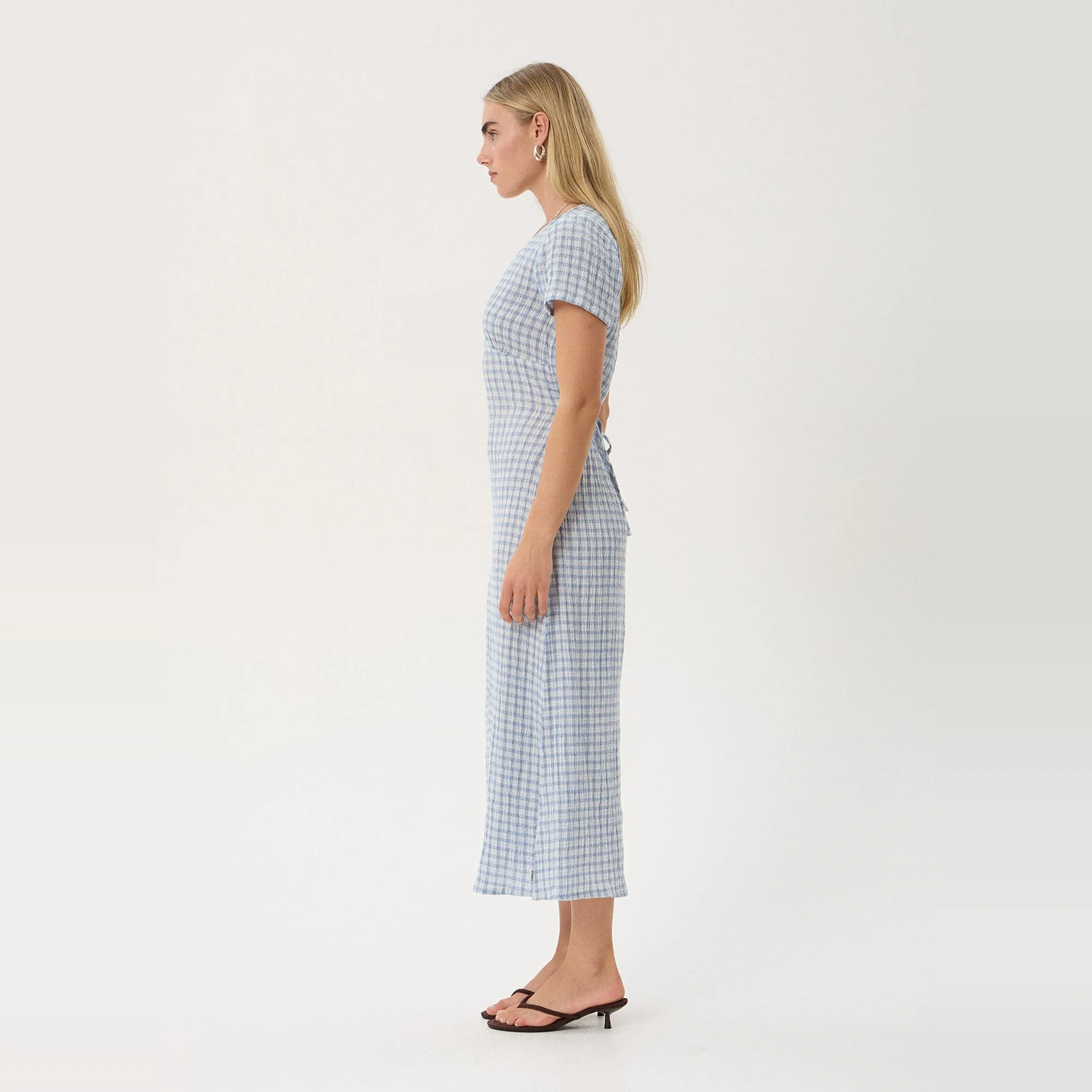 Afends Maeve Seersucker Maxi Dress in Powder Blue Check, side view showing the A-line skirt and length